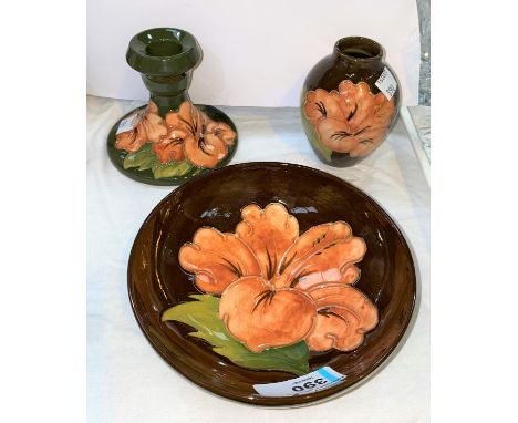 3 pieces of Moorcroft pottery "Hibiscus" pottery against a green ground comprising bowl diameter 14cm vase height 10cm and ca