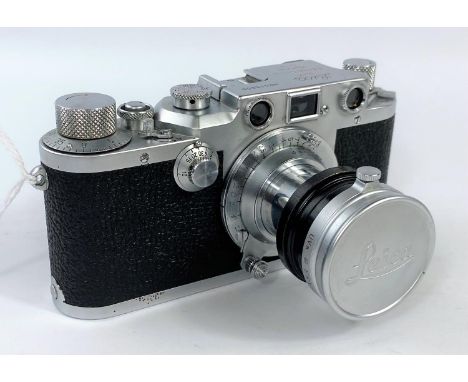 A LEICA 111c chrome 35mm camera c.1950, serial No.515800, with 50mm f3.5 Elmar lens, leather E.R case (minor corrosion to chr