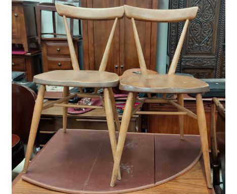 A 1950's Ercol set of 4 dining chairs in lightwood and elm 