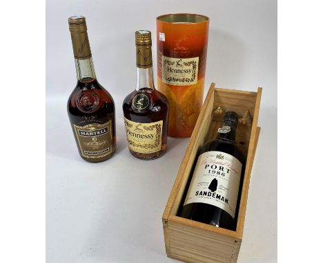 A 70 cl bottle of Sandeman LBV 1986 port, boxed; a 70 cl bottle of Martell brandy; a 70 cl bottle of Hennessy cognac 