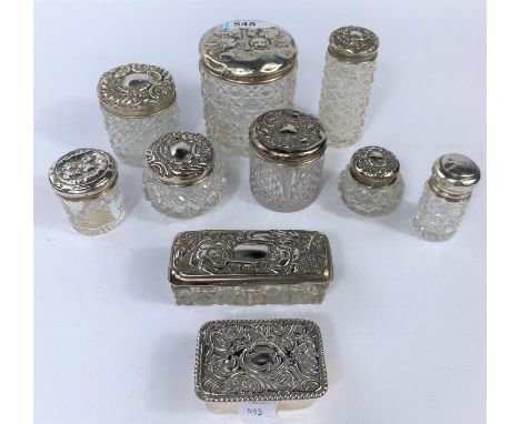 Ten glass trinket jars with hallmarked silver embossed tops 