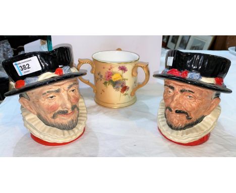 Two Royal Doulton Beefeater character jugs and a Royal Worcester peach ground three handled jug 