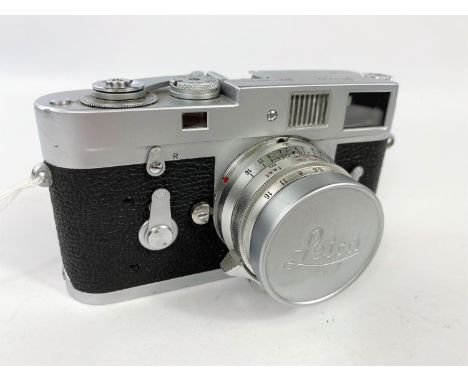 A LEICA M2 chrome 35mm camera c.1960, serial no 966842, with 35mm f2 Summicron lens, leather E.R. case.  *Please note M2 not 