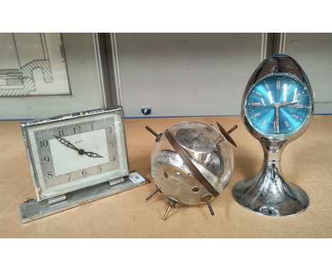 A vintage 'Sputnik' West German barometer, an Estyma egg clock and a chrome mantel clock 