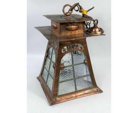 An Arts & Crafts hall lantern in planished copper, square flared form with beaded glass panels (1 a.f.), purchased from Liber