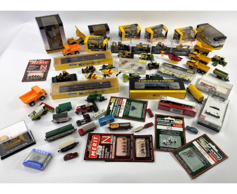 A large selection of N gauge and similar diecast and other vehicles including Caterpillar, Graham Farish etc plus packs of fi