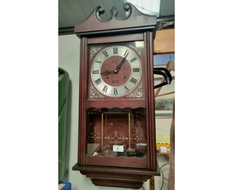 A mahogany cased reproduction Acctim 31 day wall clock.  70cm 