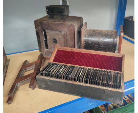 A Lantern Slide Projector  and a cased selection of slides. 