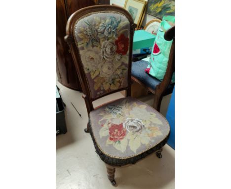 A late 19th century rosewood prie dieu chair on turned legs, tapestry seat 