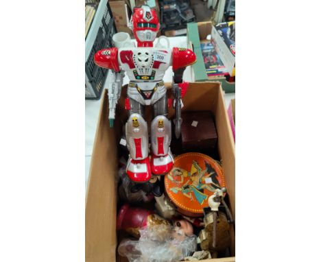 A battery operated robot in the style of a "Japanese Sentai" (battery terminals corroded); other toys 