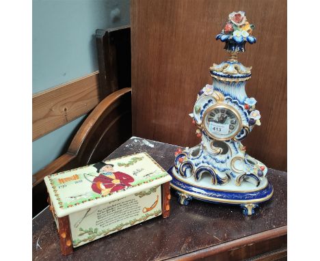 A porcelain reproduction French quartz mantel clock, blue and gilt with floral decoration and a John Peel musical box. 