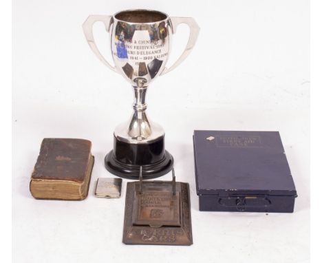 A SILVER PLATED MOTORING FESTIVAL 1988 TROPHY together with a motorist's first aid case, a Morris cars business desk calendar