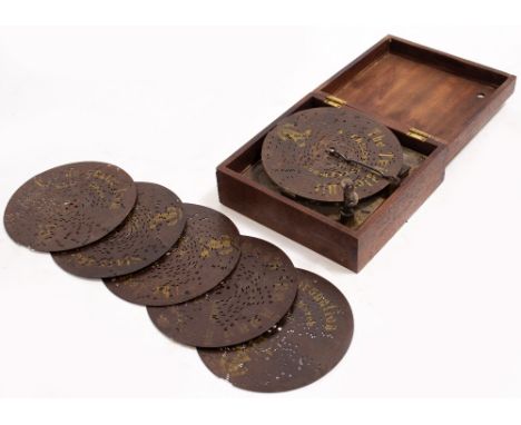 A 19TH CENTURY CONTINENTAL POLYPHON MUSICAL BOX MOVEMENT hand wound and playing 6.5 inch diameter discs, in later hardwood ca