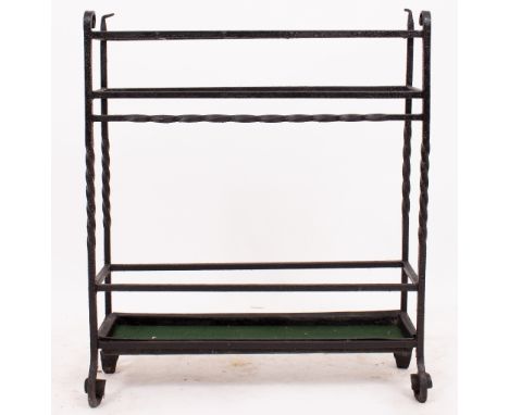 A WROUGHT IRON STICK STAND  with five sections, 65cm wide x 77cm high