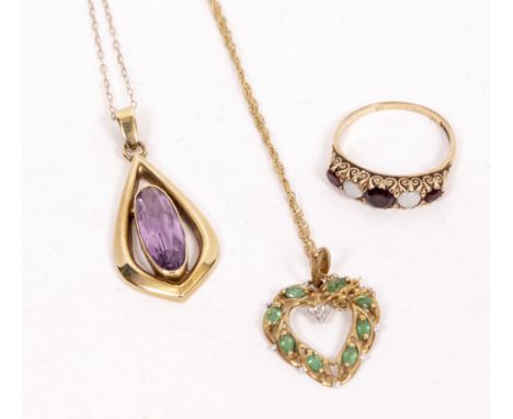 A YELLOW METAL PENDANT with an amethyst inset stone stamped 9k, a garnet and opal set 9ct gold ring and a further pendant (3)