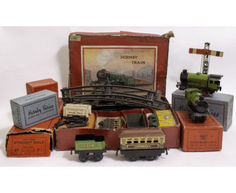 A COLLECTION OF HORNBY SERIES AND MECCANO 'O' GUAGE RAILWAY TOYS to include a clockwork train set consisting of carriages, tr