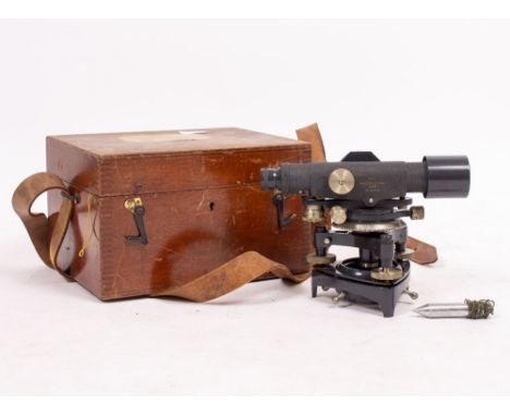 A STANLEY SURVEYORS LEVEL numbered 58222 in a fitted mahogany box together with three surveyors staffs and a tripod (5)