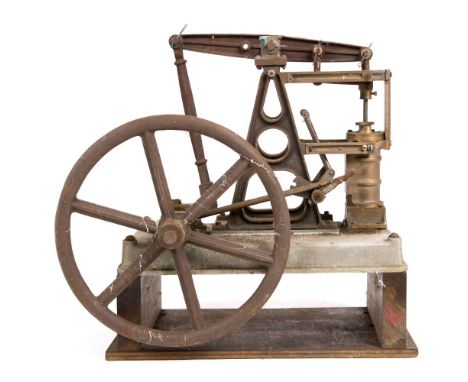 A PART BUILT MODEL  of a steam beam engine with cast 'A' frame supporting the beam and mounted on an aluminium base, the fly 