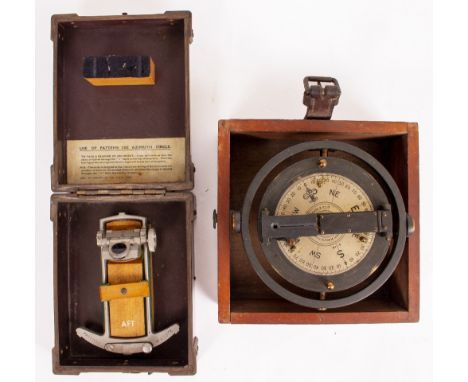 A NAVAL SURVEYING INSTRUMENT mounted on a gimbal, with rotating compass headings indicated to the silvered dial which is sign