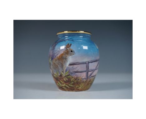 A Moorcroft Enamel mini vase designed by Terry Halloran. This limited-edition piece features an intricately detailed moonlit 