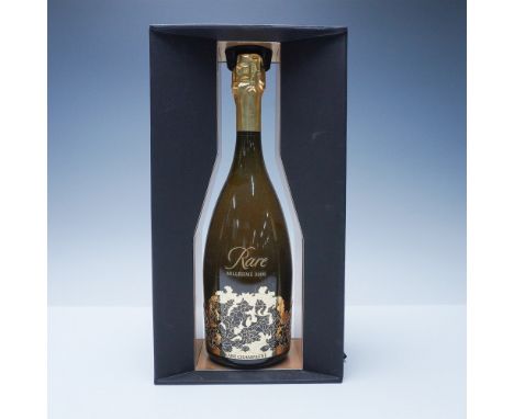 This lot features a Rare Champagne Millesime 2008 bottle, elegantly presented in its original open-front black presentation b