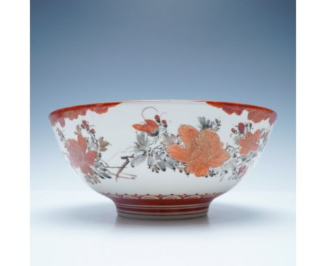 Presenting a finely crafted Japanese Kutani porcelain bowl, adorned with an intricate hand-painted floral motif in vibrant re