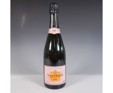 Veuve Clicquot Rose Champagne, crafted with Pinot Noir, Chardonnay, and Pinot Meunier, offers vibrant notes of red berries, c