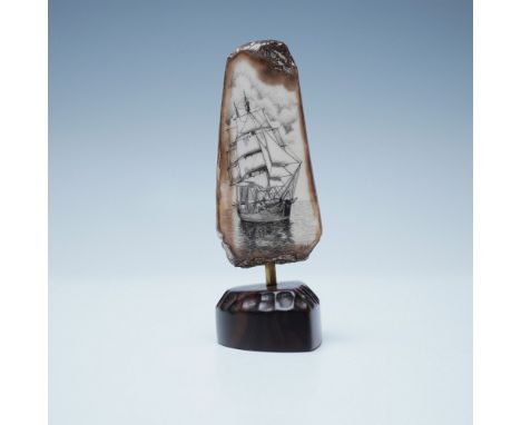 Fossilized walrus tusk scrimshaw featuring a finely detailed engraving of a sailing ship, signed R. Weiss (Robert Weiss) on t