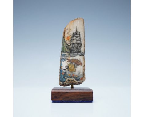 Scrimshaw artwork by Peter Kinney on a fossilized walrus tusk, titled Sunset Voyage. The hand-etched and colored design featu