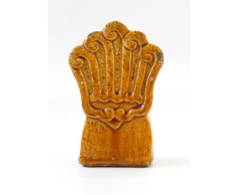 Chinese treacle glazed stoneware roof finial of stylised scroll form, 11cm high 