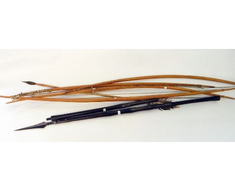 Four African tribal bows with one feathered arrow (4) 