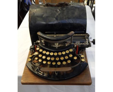 An Imperial typewriter with black metal case 