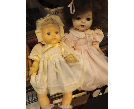 Two vintage dressed dolls