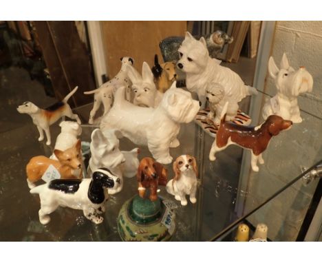 Ceramic dogs including Royal Doulton and Beswick etc  CONDITION REPORT: Three Royal Doulton and eleven Beswick.