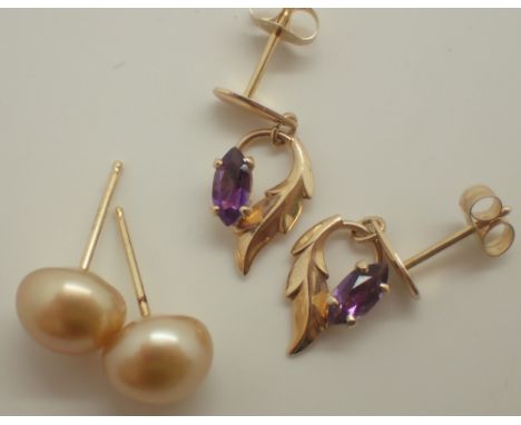 Two pairs of 14ct gold earrings one amethyst drops and one genuine pearl studs