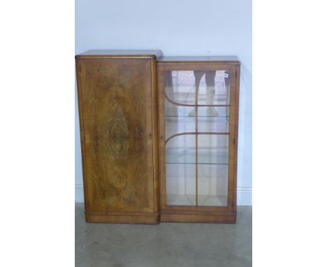 An Art Deco walnut staggered display cabinet and cupboard having quarter veneered cross banded door with glazed section havin