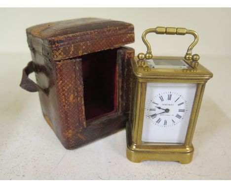 A small brass carriage clock the dial signed VINCENT WEYMOUTH - Height 8cm - working with case