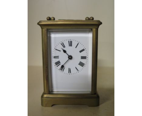 A French brass carriage clock - Height 12cm 
Condition report: Working 