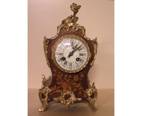A French marquetry inlaid mantel clock with ormolu mounts, the movement stamped Maple and Co Paris, striking on a gong - Heig