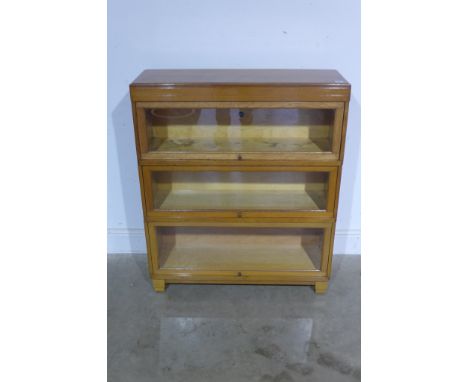 A three section light oak Globe-Wernicke bookcase - Height 101cm x 86cm x 29cm 