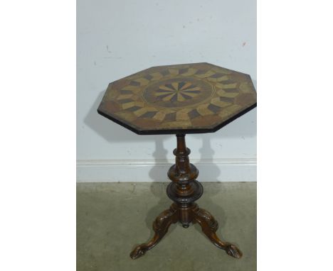A 19th century marquetry inlaid sidetable with an octagonal top on a carved walnut tripod base - Height 76cm x Width 56cm