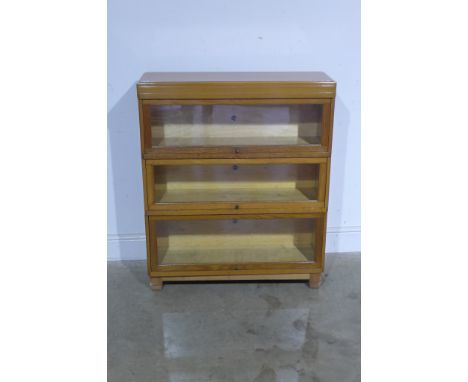 A light oak finish three section bookcase, each section marked Globe-Wernicke - Height 101cm x 86cm x 29cm 
Condition report: