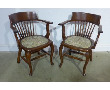 A pair of 1920's light oak desk type armchairs with tapestry seat and spindle back 
Condition report: In excellent condition 