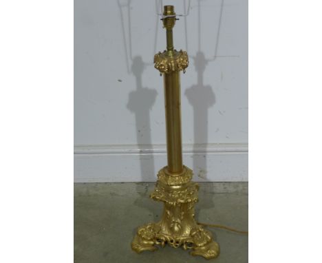 A modern gilt metal table lamp on a tripartite scrolling base with shade - Height 97cm - working order