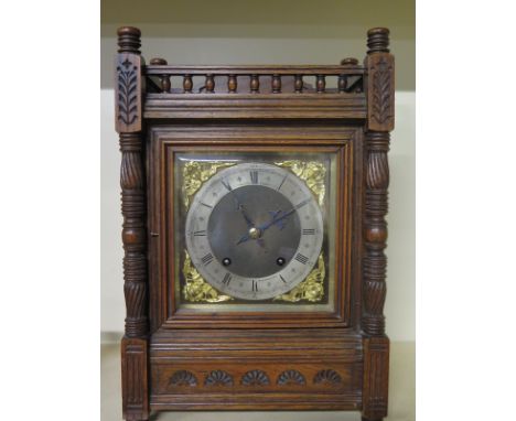 An oak case mantel clock with an eight day striking movement stamped W.H.  SCH retailed by Arthur Punt London - Height 40cm x