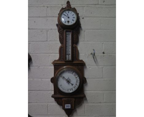 A late Victorian carved oak clock barometer with thermometer - Height 70cm