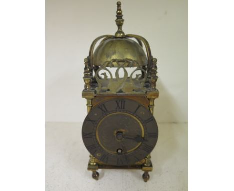 A 20th century brass lantern clock by Webster of London - Height 24cm - working