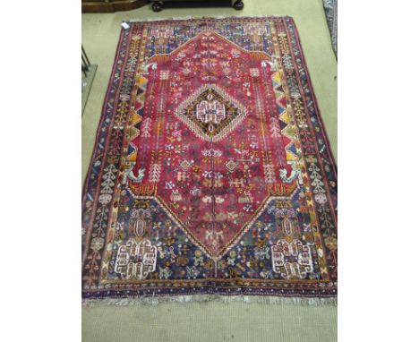 A medium sized early 20th century Eastern handknotted multi coloured wool rug with isometric designs - 260cm x 140cm 
Conditi