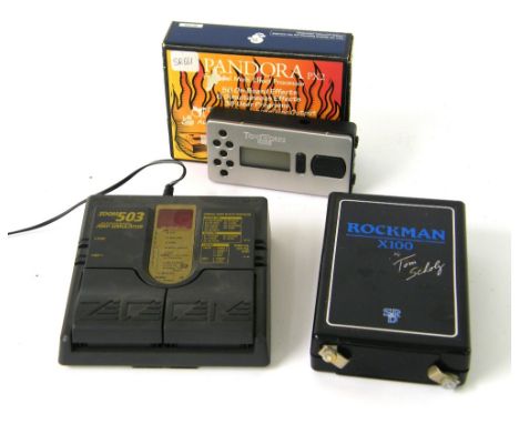Tom Scholz Rockman X100 guitar/keyboard headphone amplifier; together with a Pandora PX2 personal multi-effects processor and