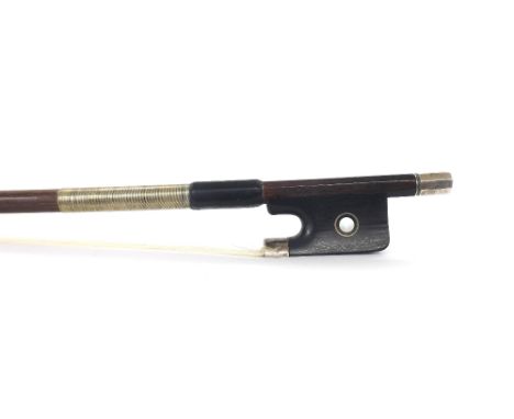 English silver mounted violoncello bow by and stamped W.E. Hill & Sons, the stick round, the ebony frog inlaid with silver ri